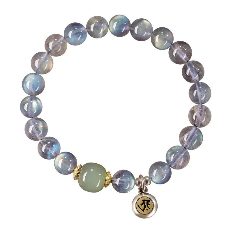 Close-up of an 8mm Moonstone crystal bracelet showing a detailed Thousand-Hand Kwan-yin mouse design.