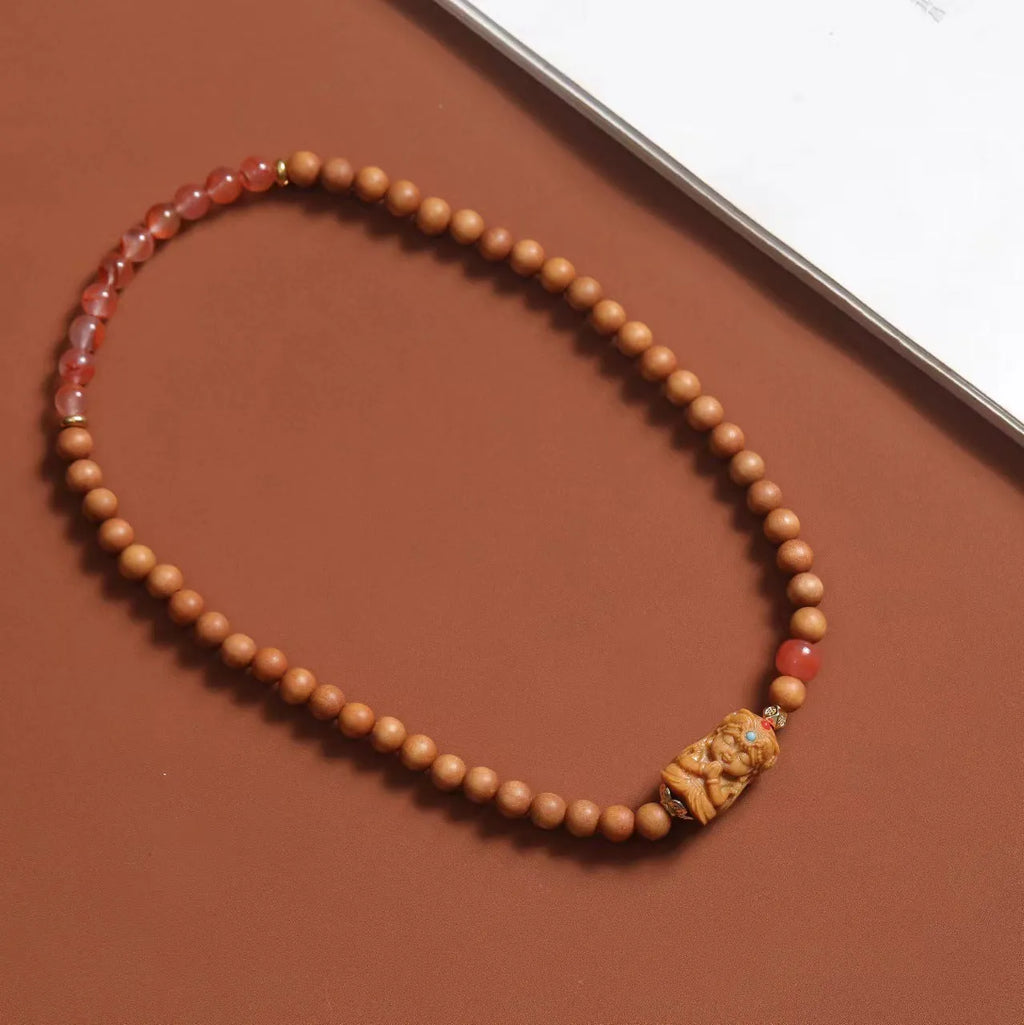 Brown wooden bracelet with 6mm round beads featuring double circle pattern