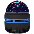 Compact USB-powered LED galaxy projector lamp with remote control on a table