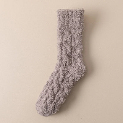 Cozy coral fleece socks in various colors, featuring soft velvet material and anti-slip design for comfort and warmth.