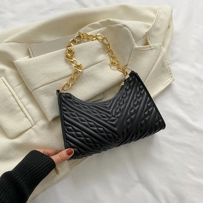 Brown pleated chain strap baguette shoulder bag showing vertical square shape and soft handle.