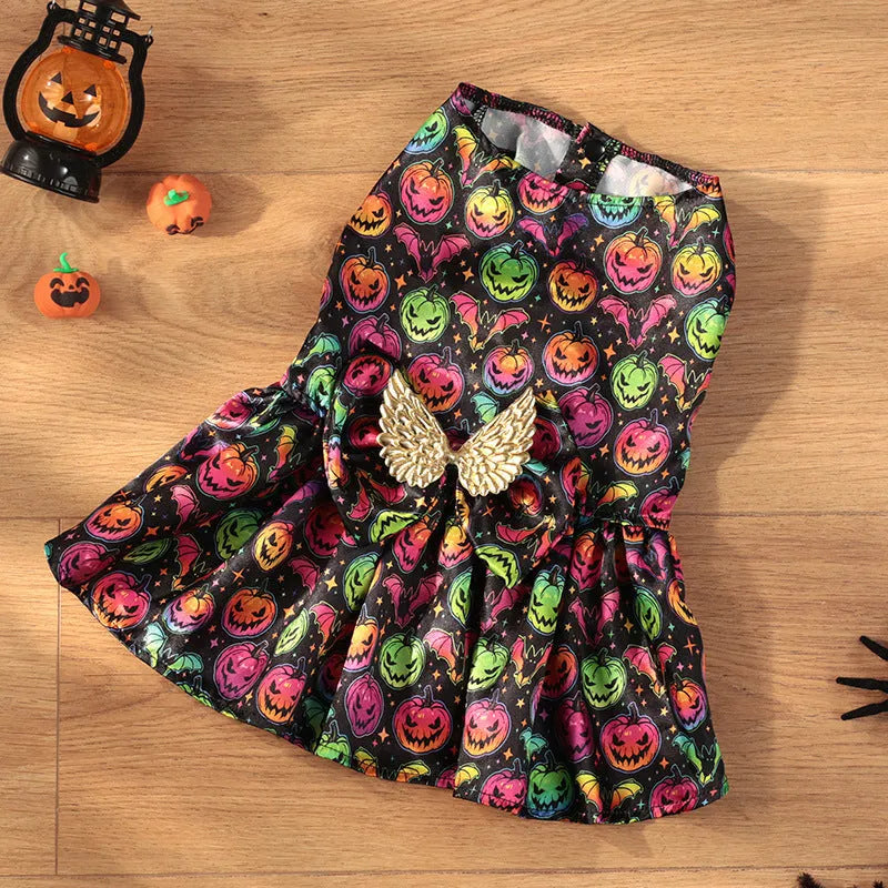 Orange Halloween dog costume with angel wings and a halo, featuring a bright pumpkin print design.