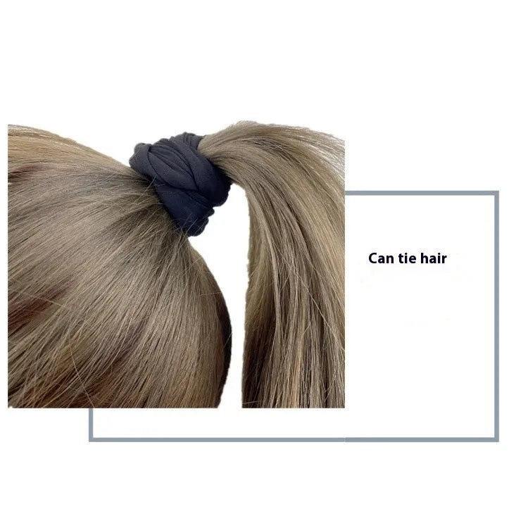 Compact 10 by 10.5 cm black armband sleeve for mobile phone, shown with packaging.