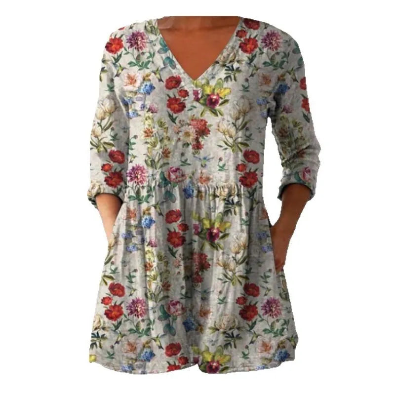 Women's printed loose-fit maxi dress with wide waist and three-quarter length sleeves.