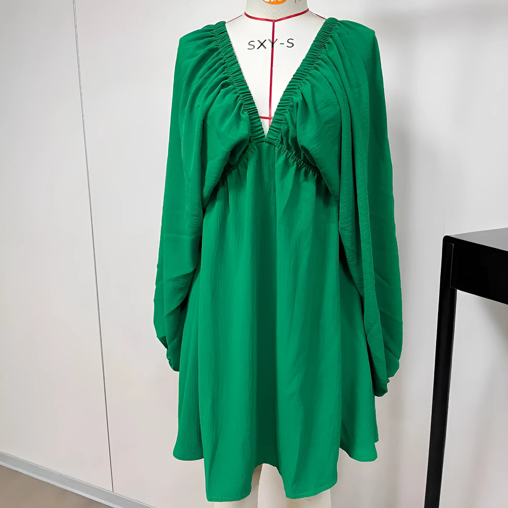 Women's apricot V-neck dress with long puff sleeves and a flounced swing skirt, mid-waist design.