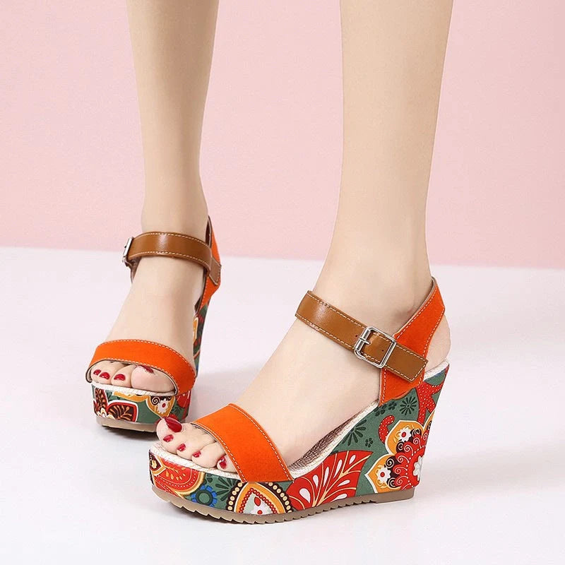 Women's floral embroidered wedge sandals in black, green, and orange with buckle strap