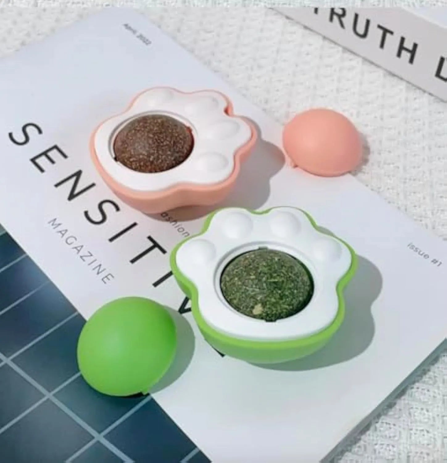Colourful catnip balls with textured edible vine surfaces for feline dental care and interactive play