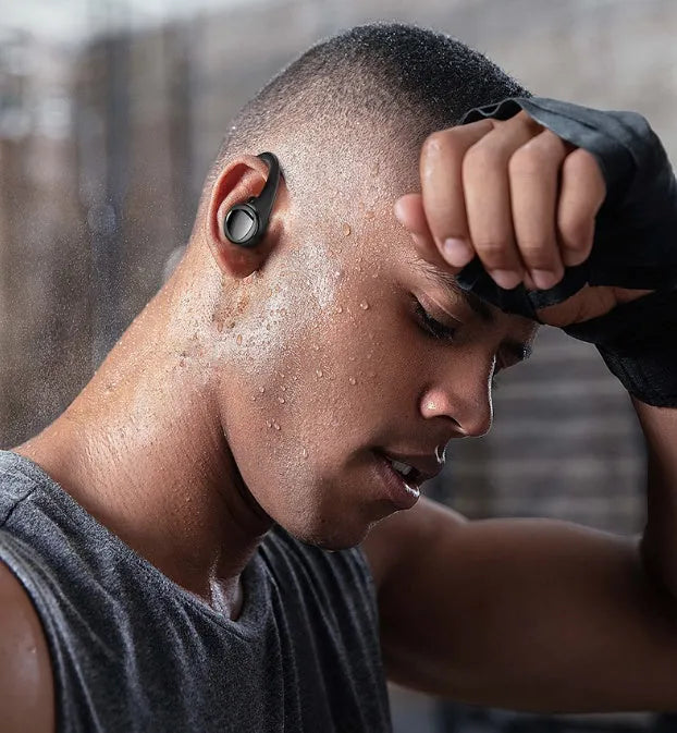 Black and silver true wireless Bluetooth in-ear headphones with charging case.