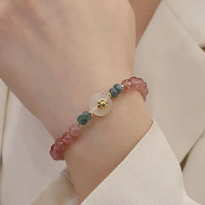 Women's strawberry quartz bracelet with blue water emerald stones and round jade pendant on geometric chain