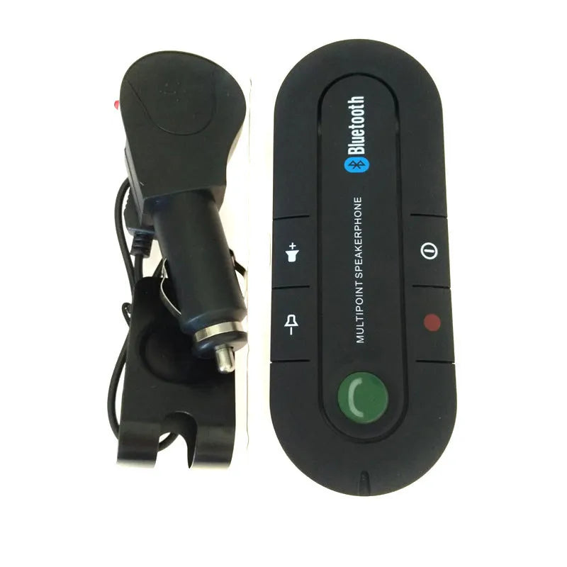 Black vehicle-mounted Bluetooth handsfree device clipped to a car sun visor with power cable.
