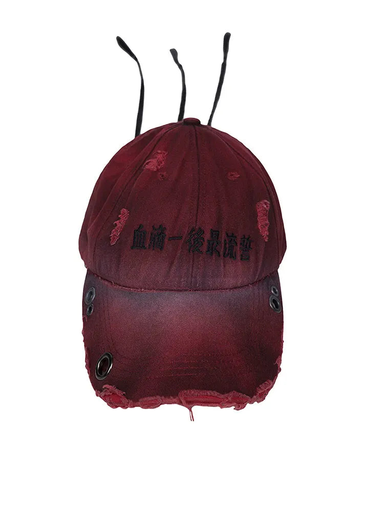 Rose red cotton peaked cap with adjustable strap and vintage spray-dirty finish