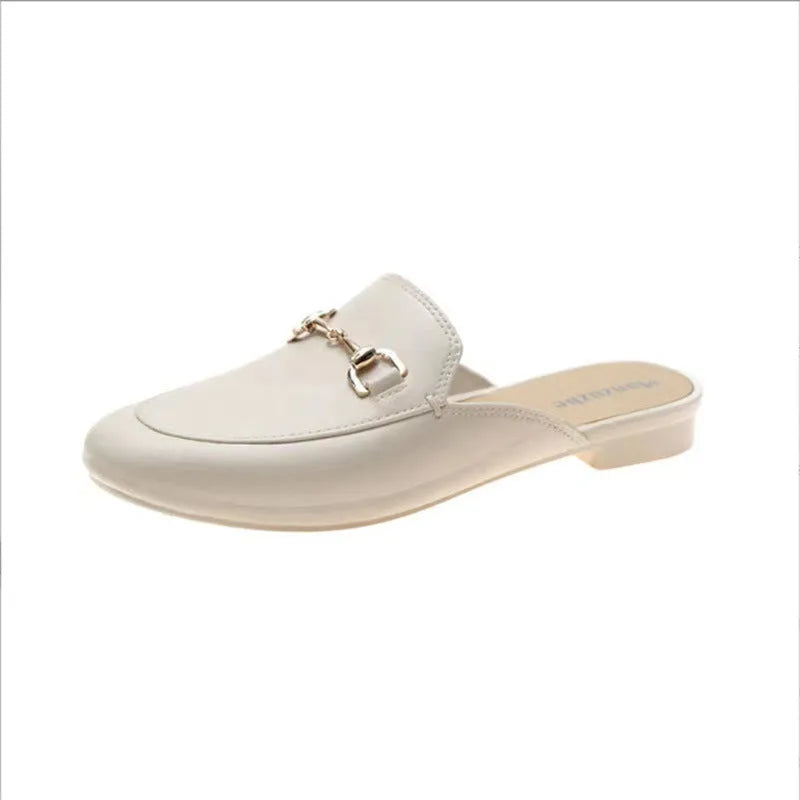 Women's PVC closed toe half slippers shown in milky white colour with a double buckle fastener.