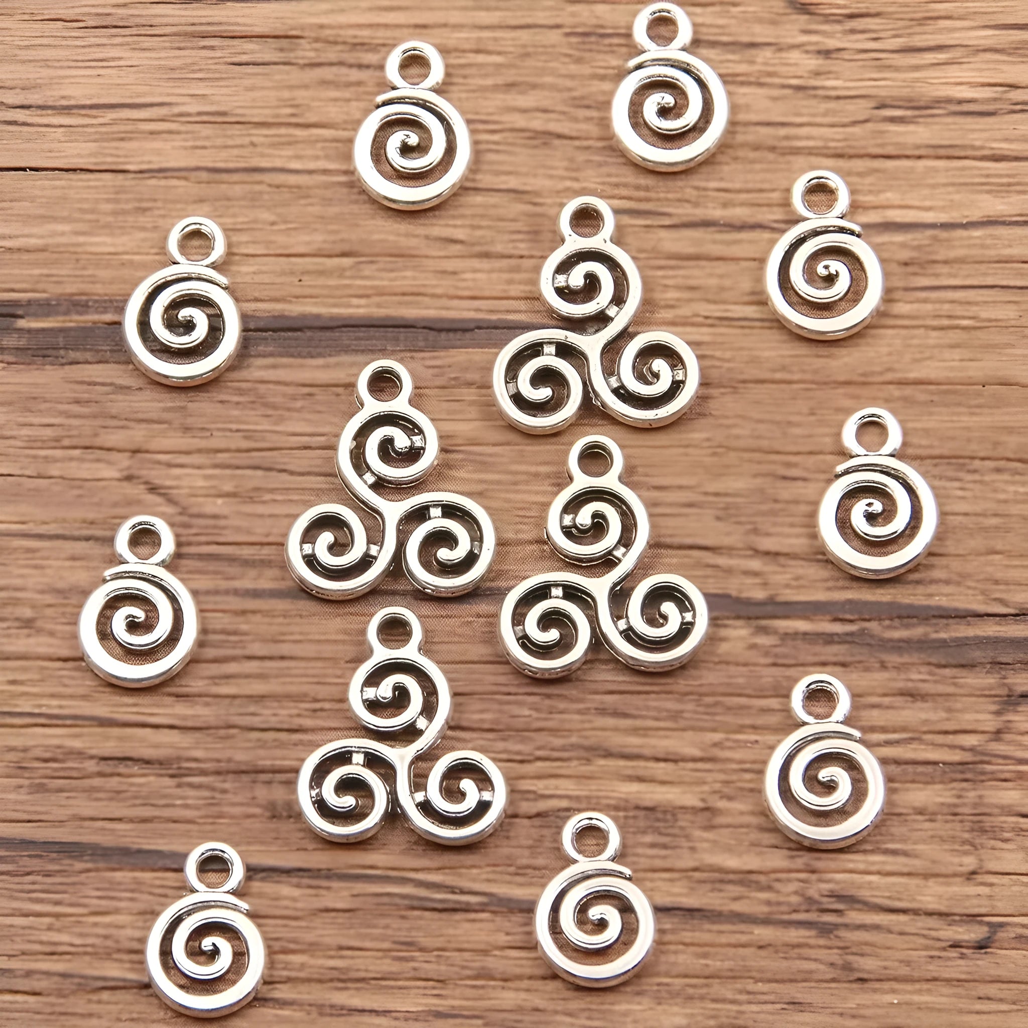 Double-sided hollow circle pendant in alloy with electroplated finish, simple round style, 7x11mm size on white background