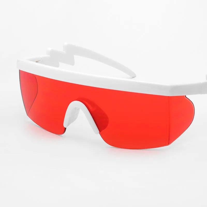 Sports sunglasses with curved foot piece design showing colourful film lenses and UV400 protection in PC frame