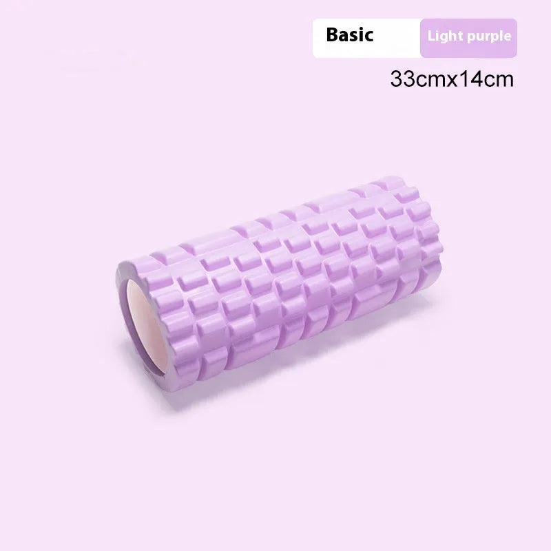 EVA foam roller in black, shown next to smaller pink and sky blue rollers of different sizes.