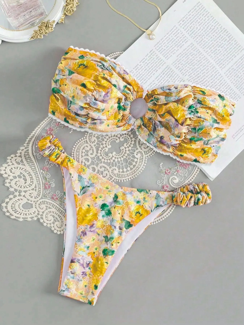 Blue floral print women's bikini set with lace trim on sleeveless tube top and matching briefs.