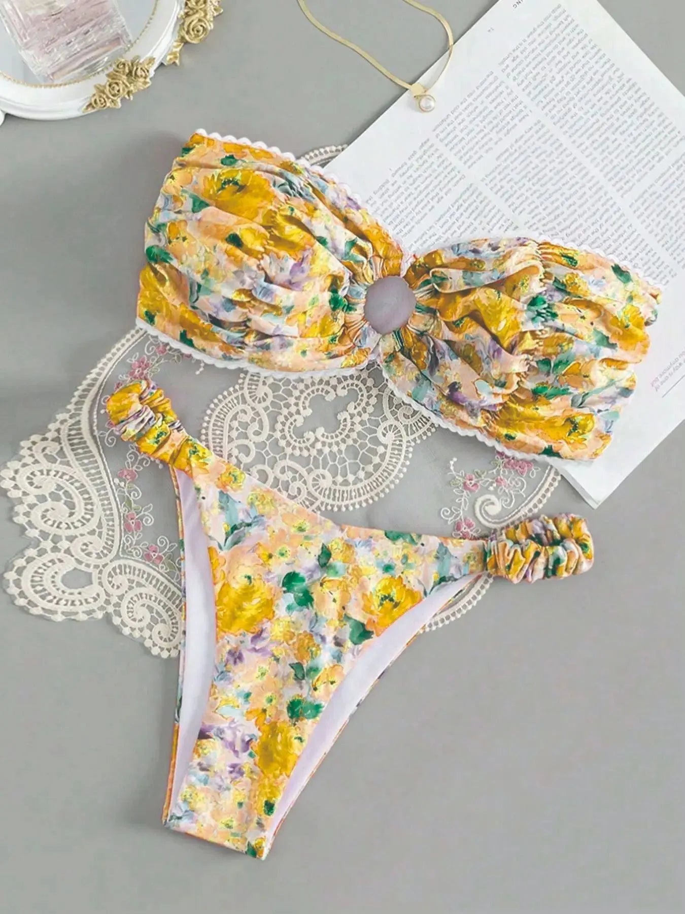 Blue floral print women's bikini set with lace trim on sleeveless tube top and matching briefs.