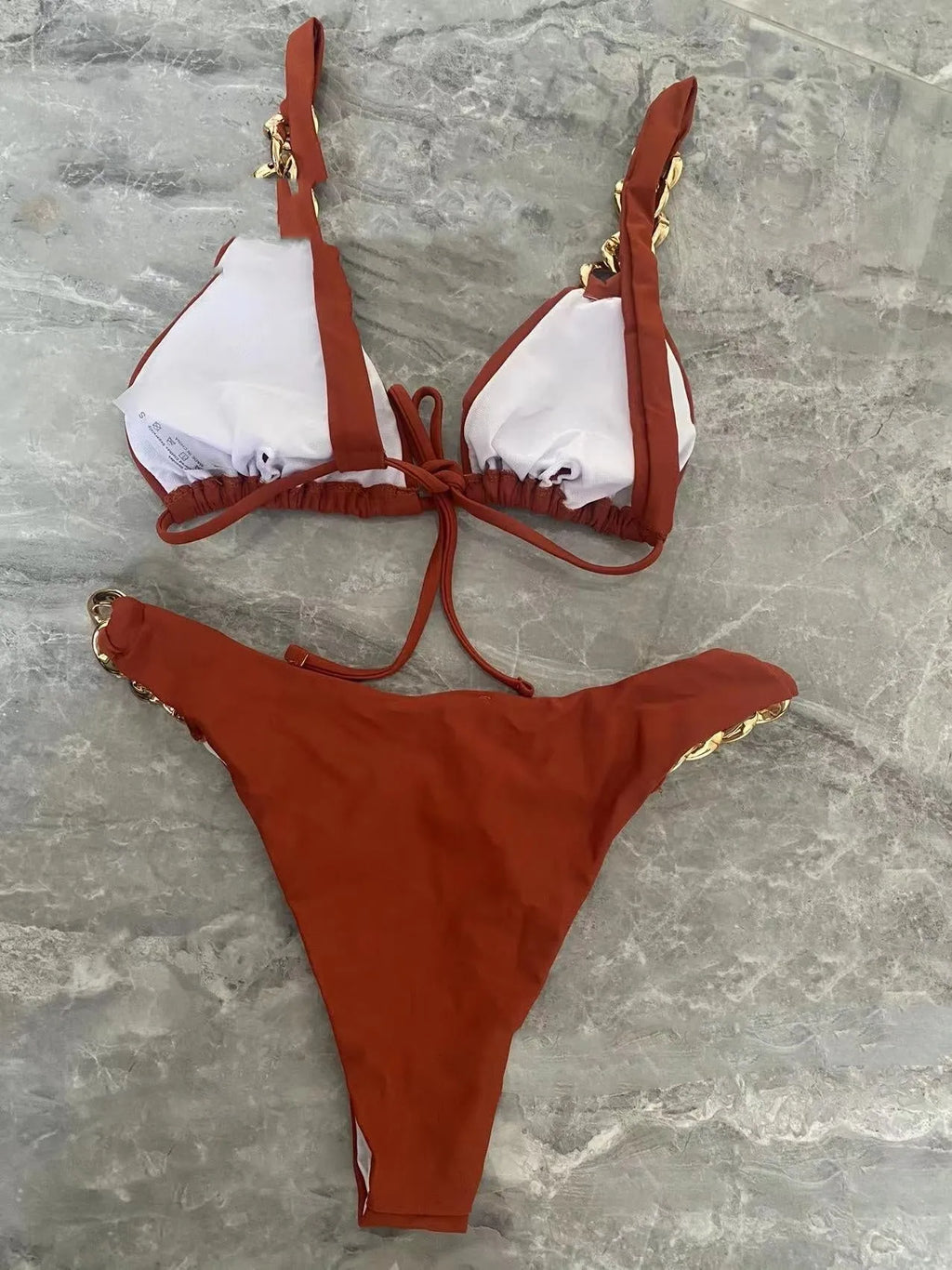 Brown women's tube top bikini swimsuit with an adjustable ring tether and split design.