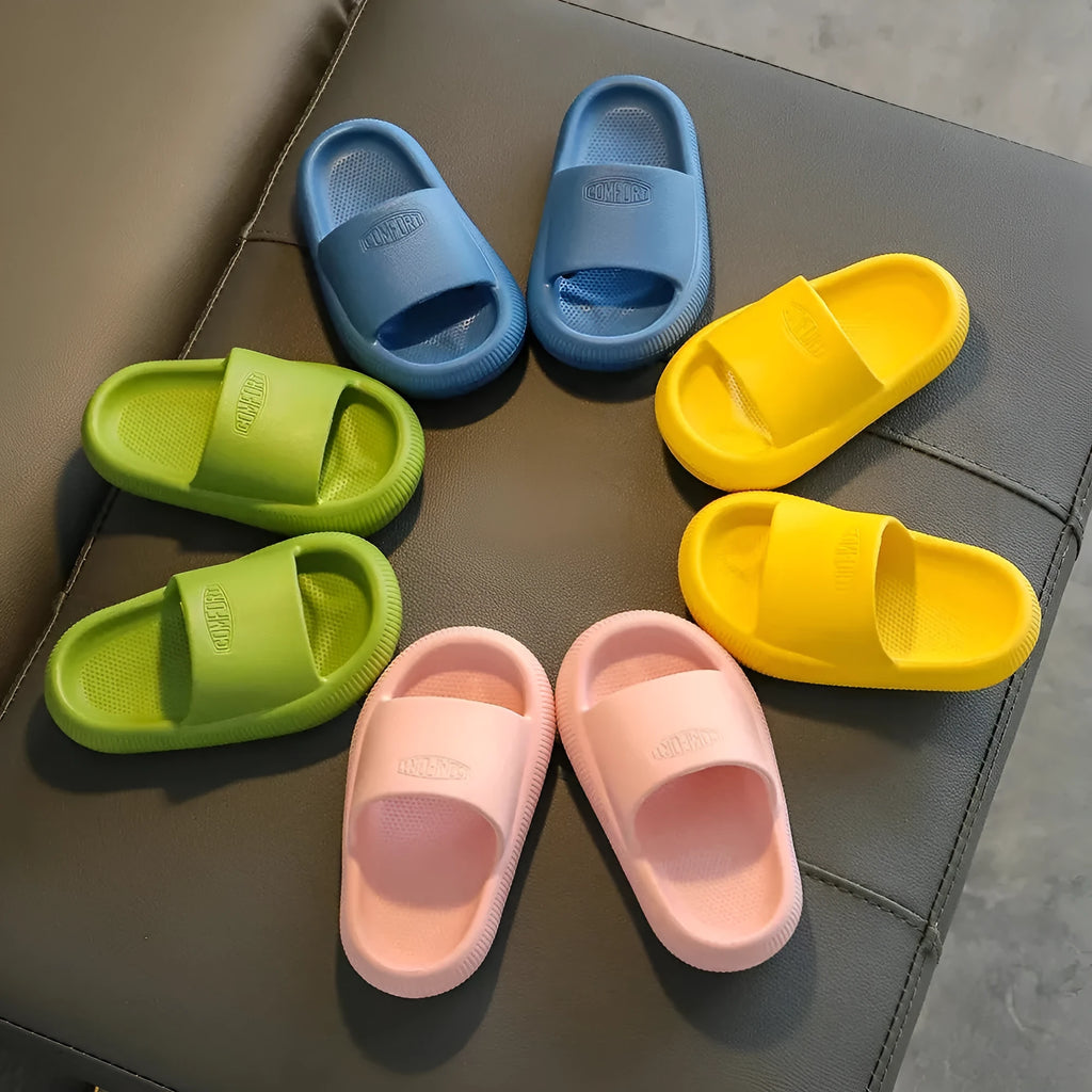 Children's colourful EVA slippers with a non-slip sole, shown in blue, green, orange, pink, and yellow.