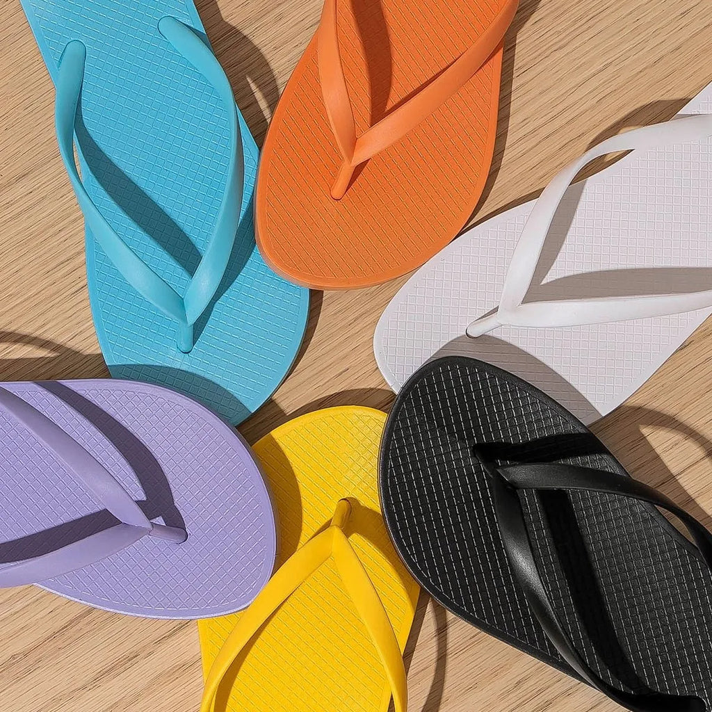 Foldable flat slippers with plastic hollow-out upper and non-slip PVC sole in various colours