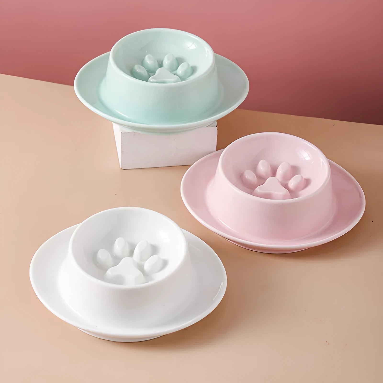 Ceramic slow feed pet bowl in green with internal ridges and neck protection design.