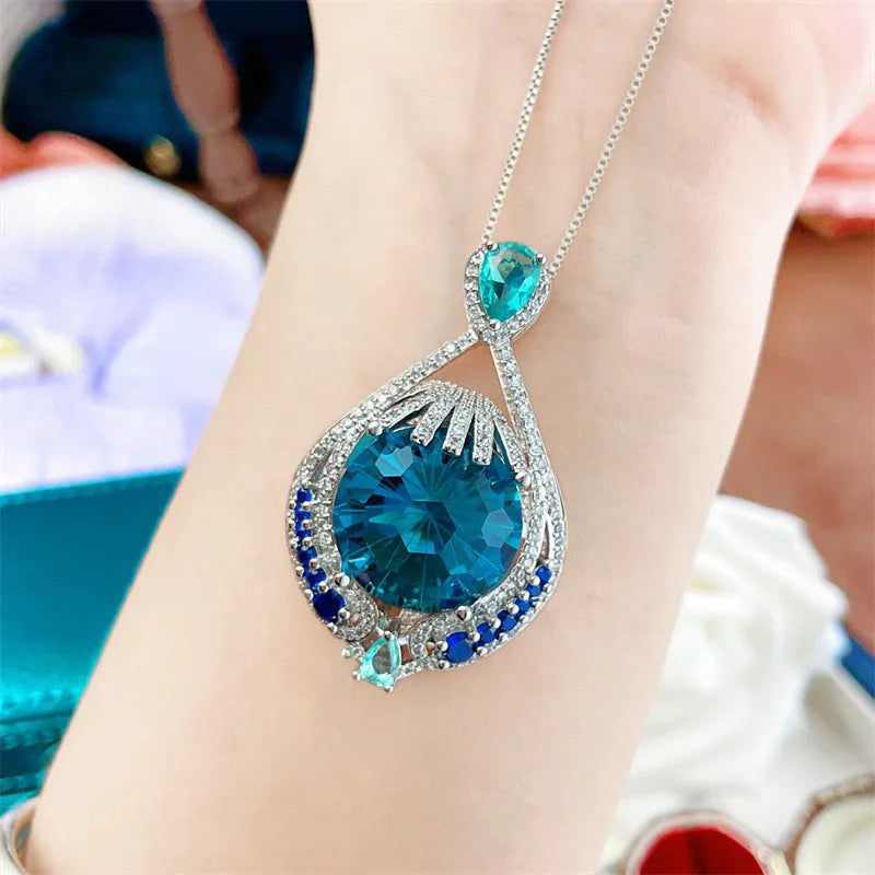 Blue crystal geometric necklace with fireworks cut gemstone on water wave chain