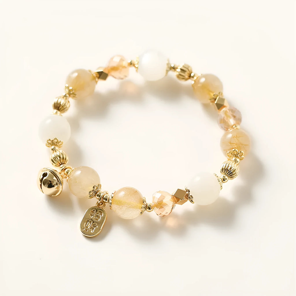Gold electroplated adjustable chain bracelet with a rutilated quartz crystal in Lucky Fortune colour.