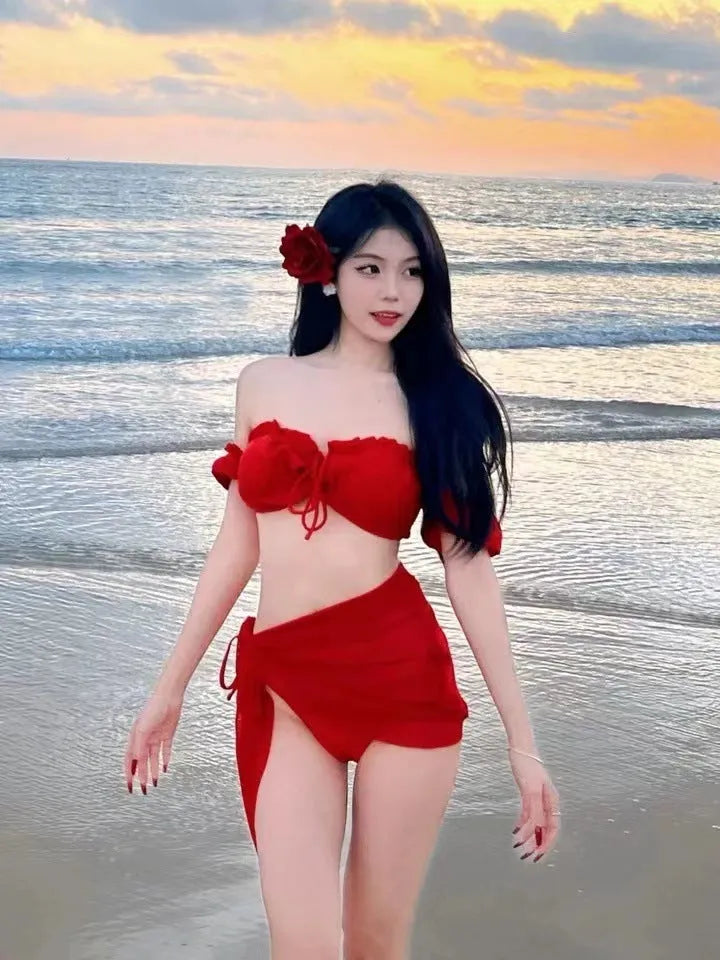 Red women's bikini swimsuit with puff sleeve skirt top and briefs.