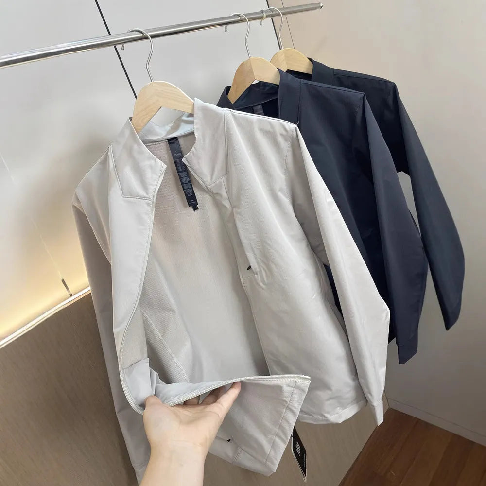 Men's black stand collar casual jacket with long sleeves and a straight hem.