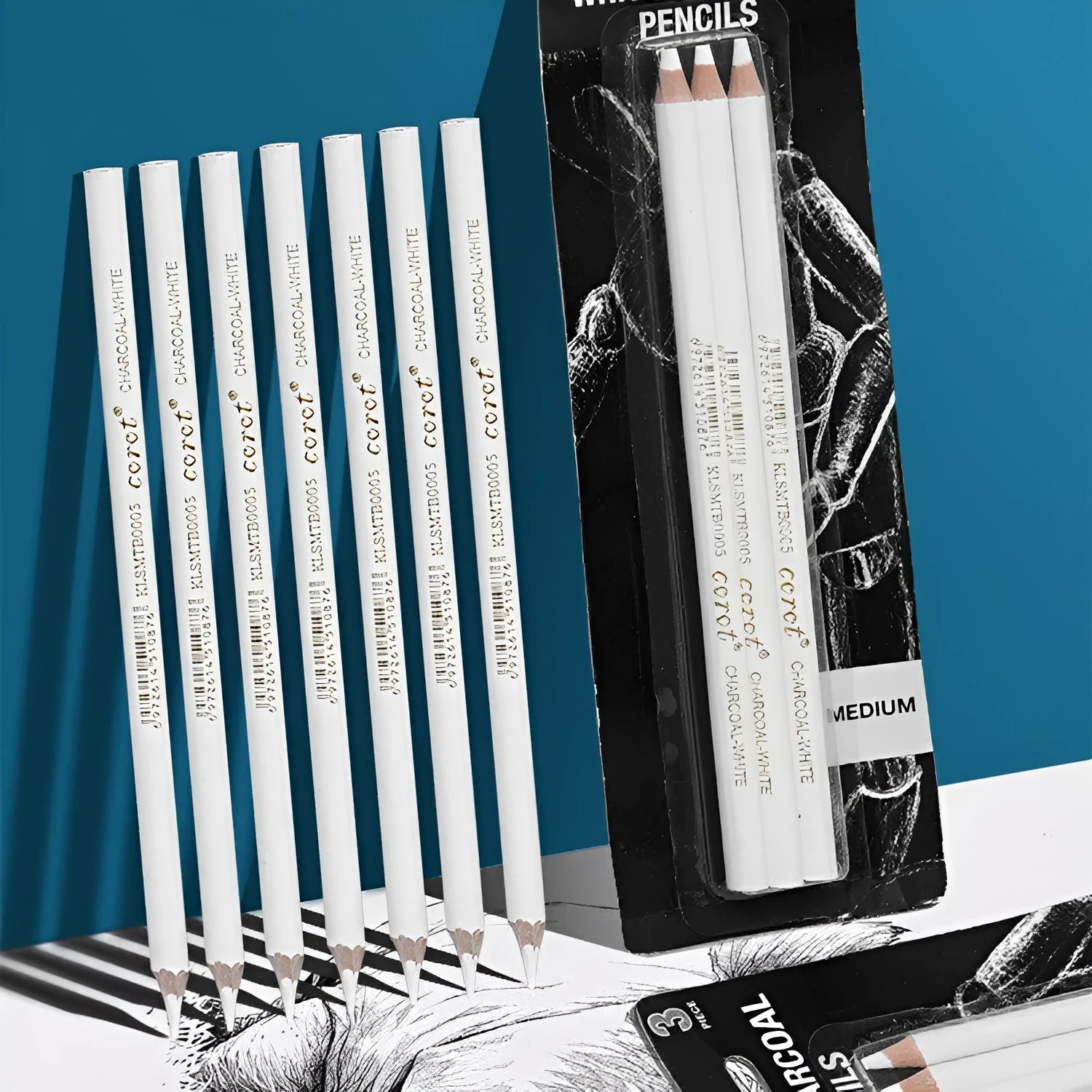 Three white charcoal highlighting pencils with wooden casings for sketching on dark paper