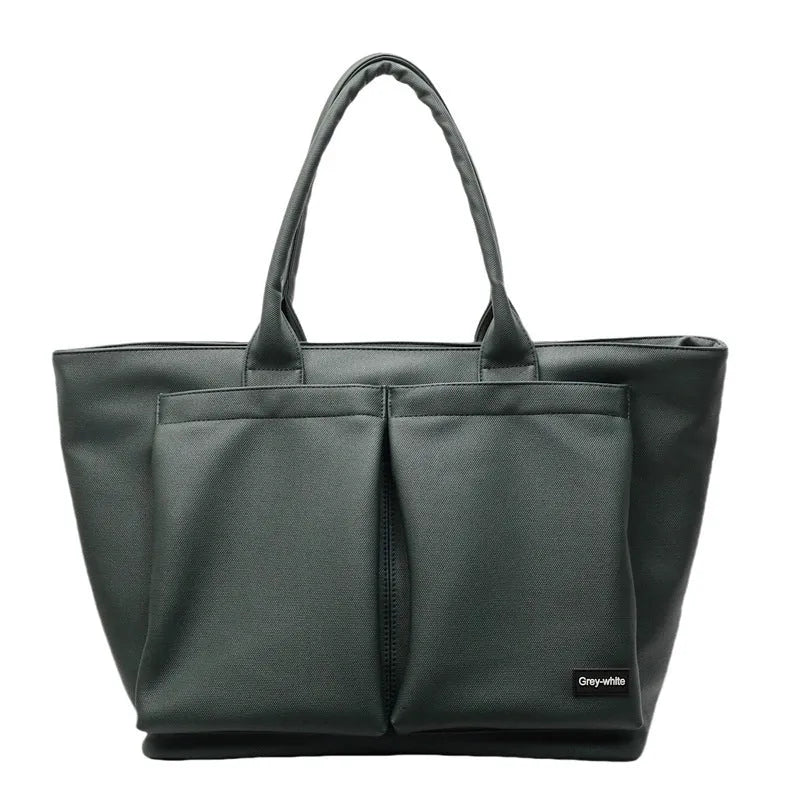 Lightweight sporty shoulder bag in PU material, shown in green colour