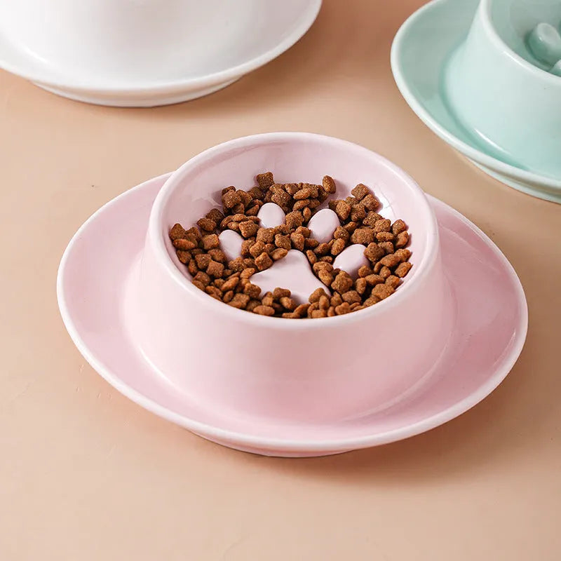 Ceramic slow feed pet bowl in green with internal ridges and neck protection design.