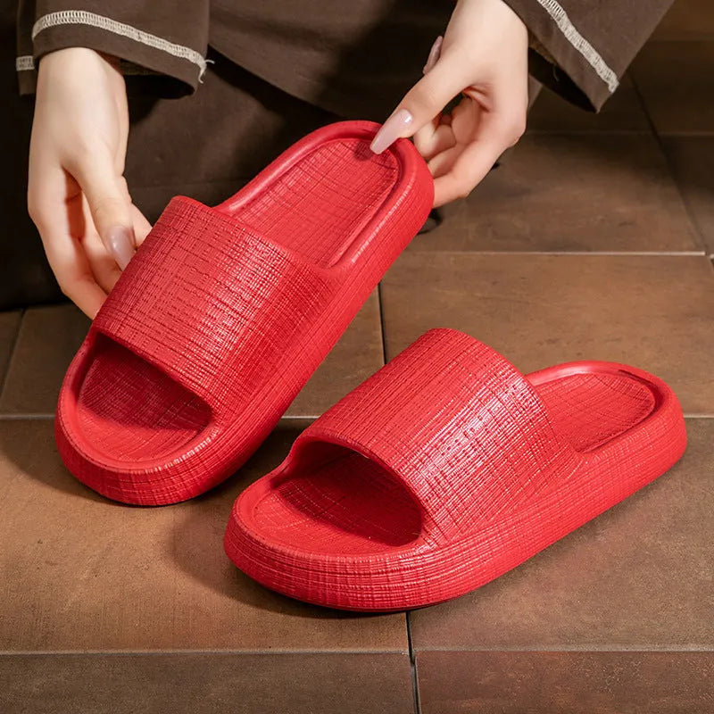 A pair of soft-bottom EVA bath slippers with a toe ring and non-slip sole, shown in one of five available colours.