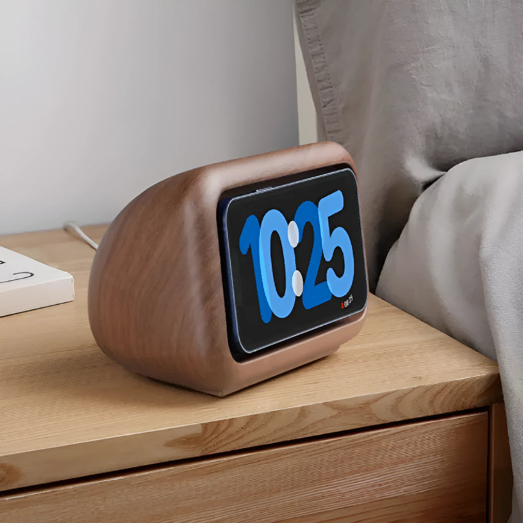 Magnetic wireless charging phone holder stand with alarm clock in white, small size, on a wooden desktop