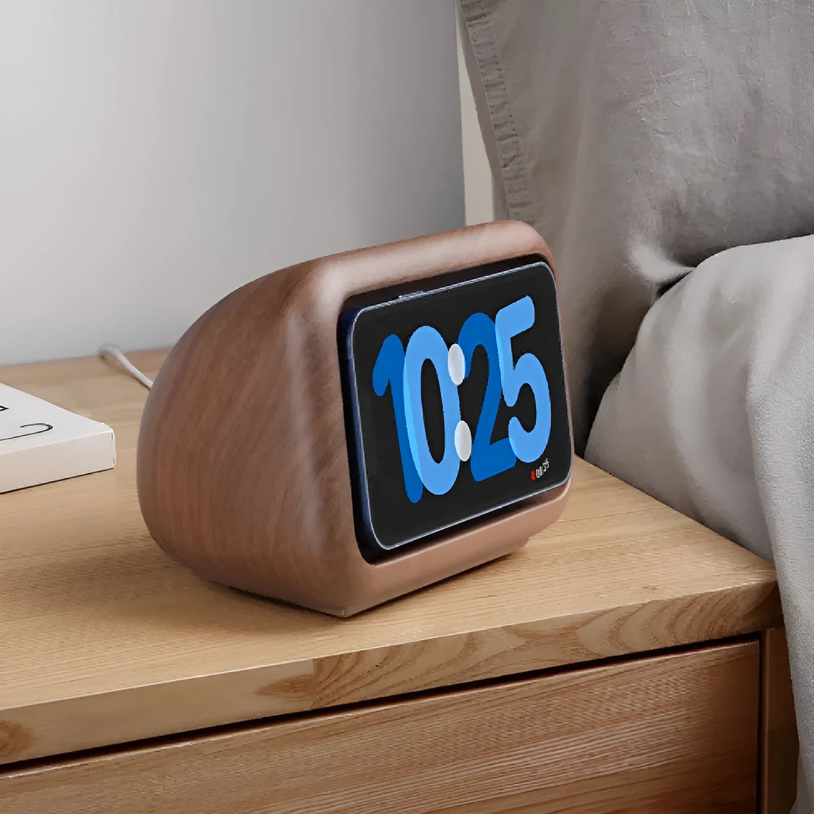 Magnetic wireless charging phone holder stand with alarm clock in white, small size, on a wooden desktop