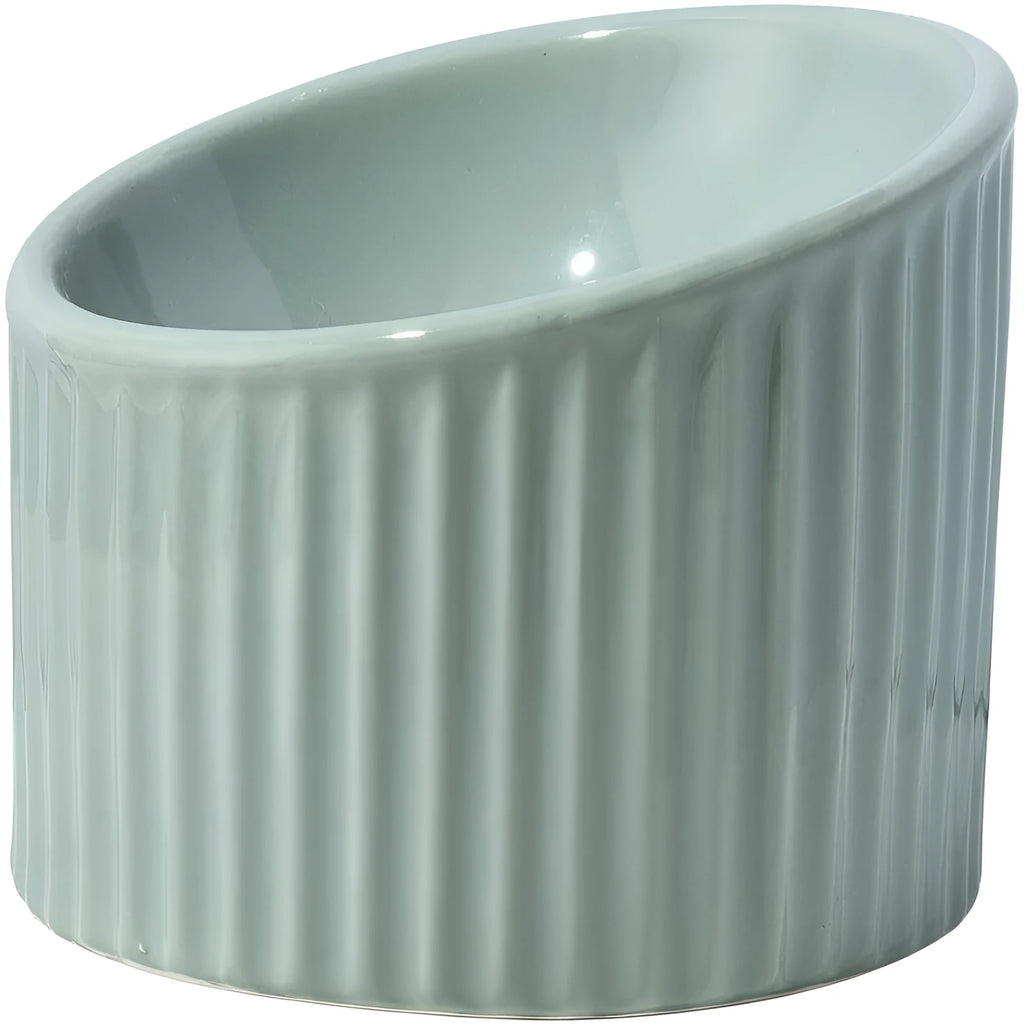 Elevated ceramic cat bowl in dark green, showing its tilted design and round, whisker-friendly shape.