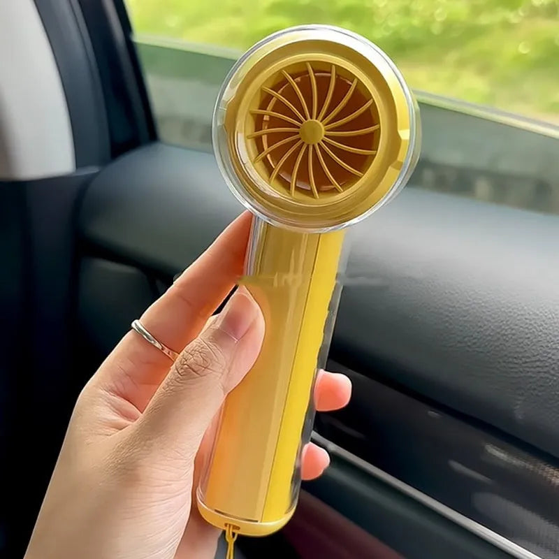 Small handheld fan with ice compress function in black, white, or yellow colours, showing portable size.