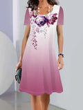 Women's floral print midi dress in ice silk fabric on a hanger, showing A-line shape and short sleeves.