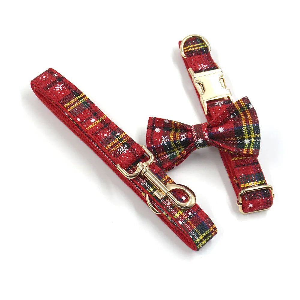 Red cloth Christmas dog collar and harness set with matching bow tie and waste bag holder on size tag
