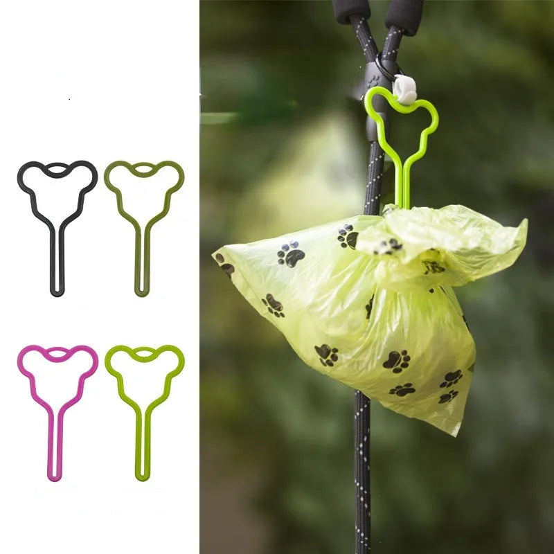 Dog poop bag holder with hands-free clip and hook and loop fastener for leash attachment