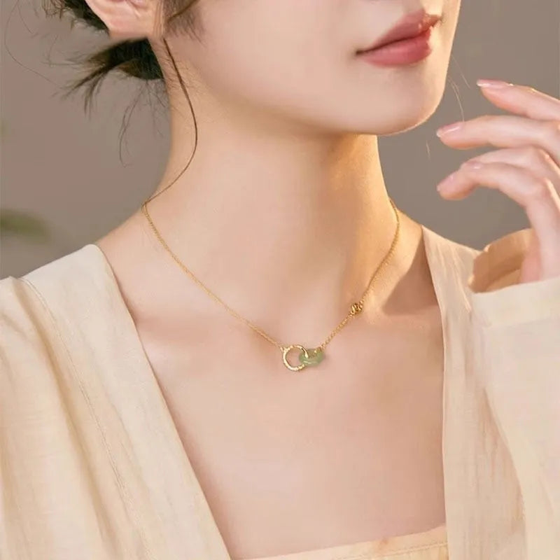 Handmade sterling silver bamboo joint peace buckle necklace with pearl details on an O-chain.