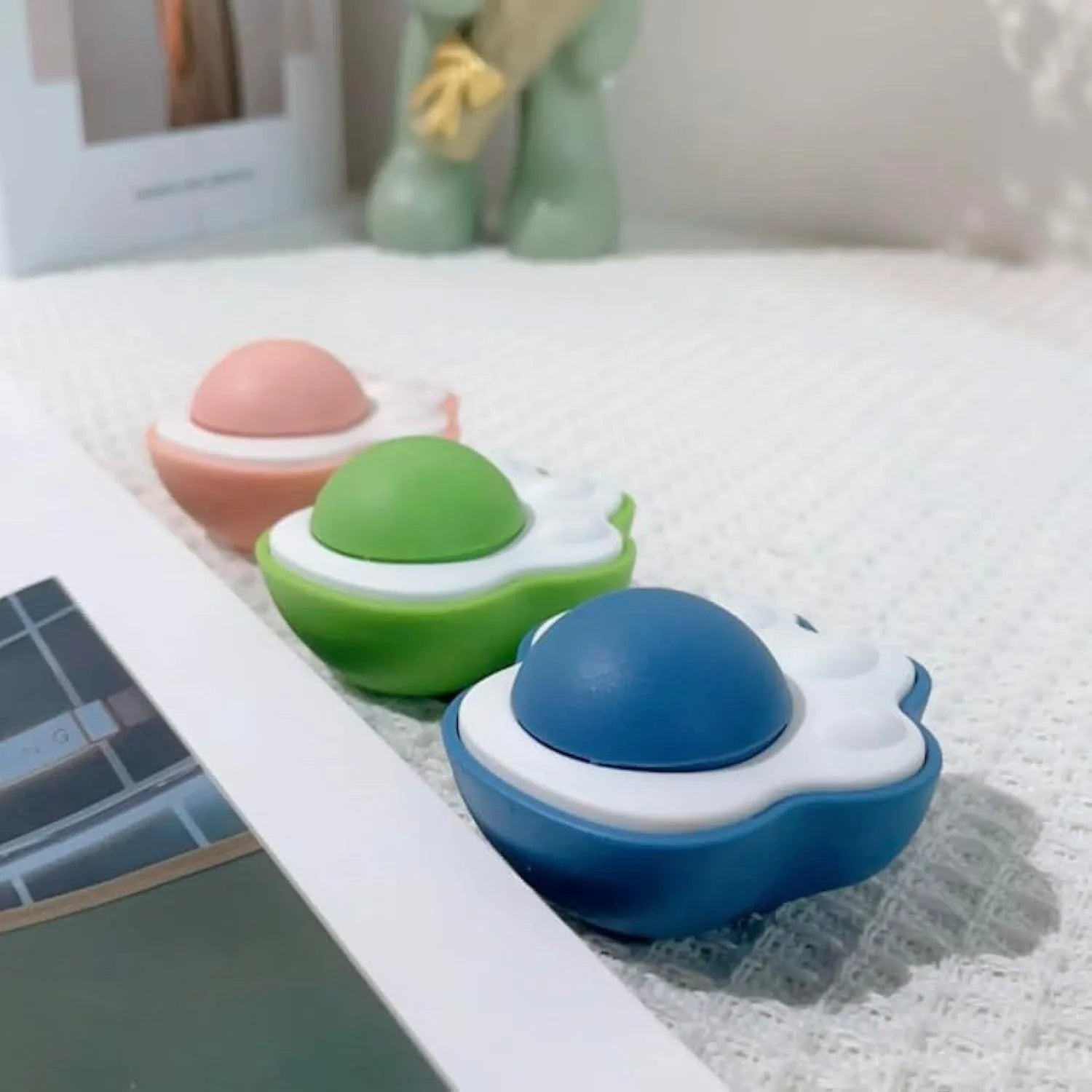 Colourful catnip balls with textured edible vine surfaces for feline dental care and interactive play