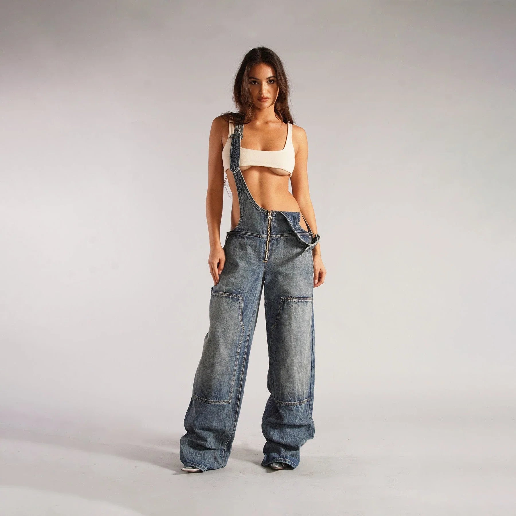 Trendy denim overalls with pockets, featuring a unique Y2K-inspired design, micro-elastic fit, and convenient layout for a stylish and comfortable streetwear look.