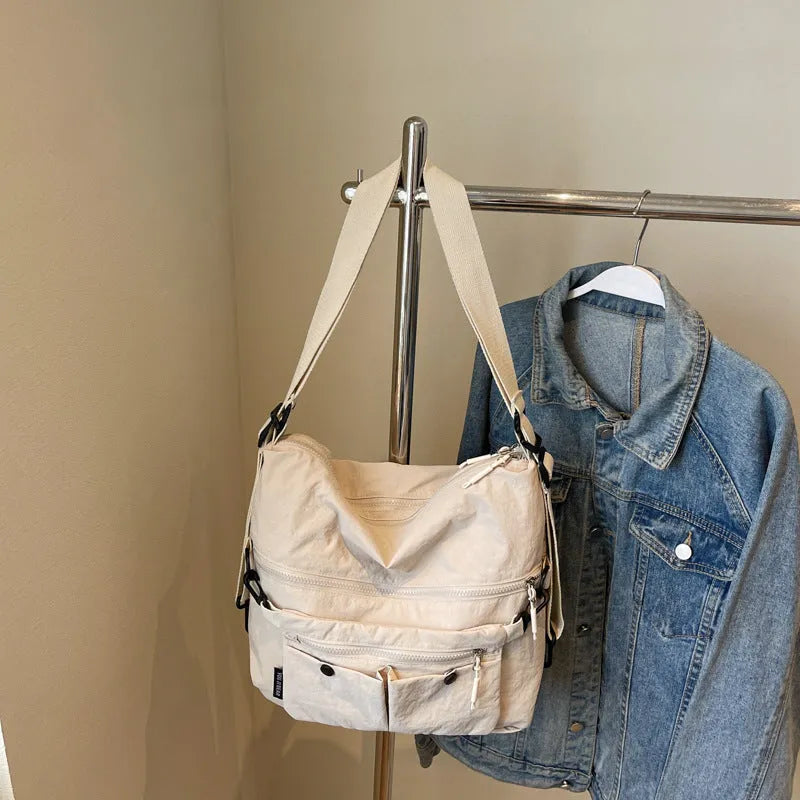 Women's nylon crossbody bag in square vertical shape with double shoulder straps and three-dimensional pockets