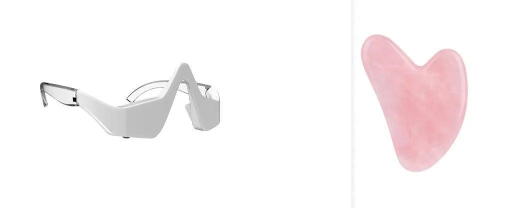Pink and white micro-current eye massager with glasses-style frame on a grey background.