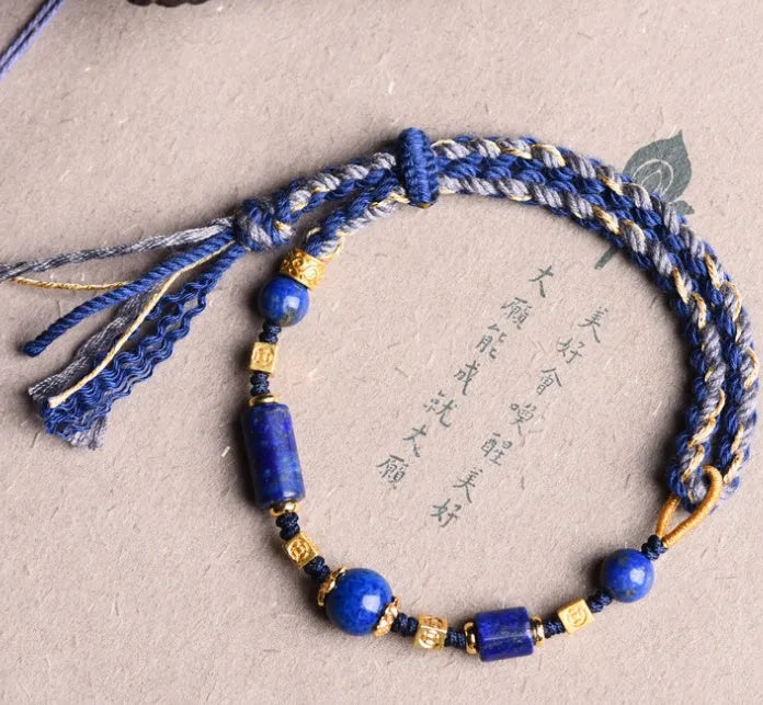 Close-up of a hand-woven flexible wire watch band in Lapis Lazuli blue colour.