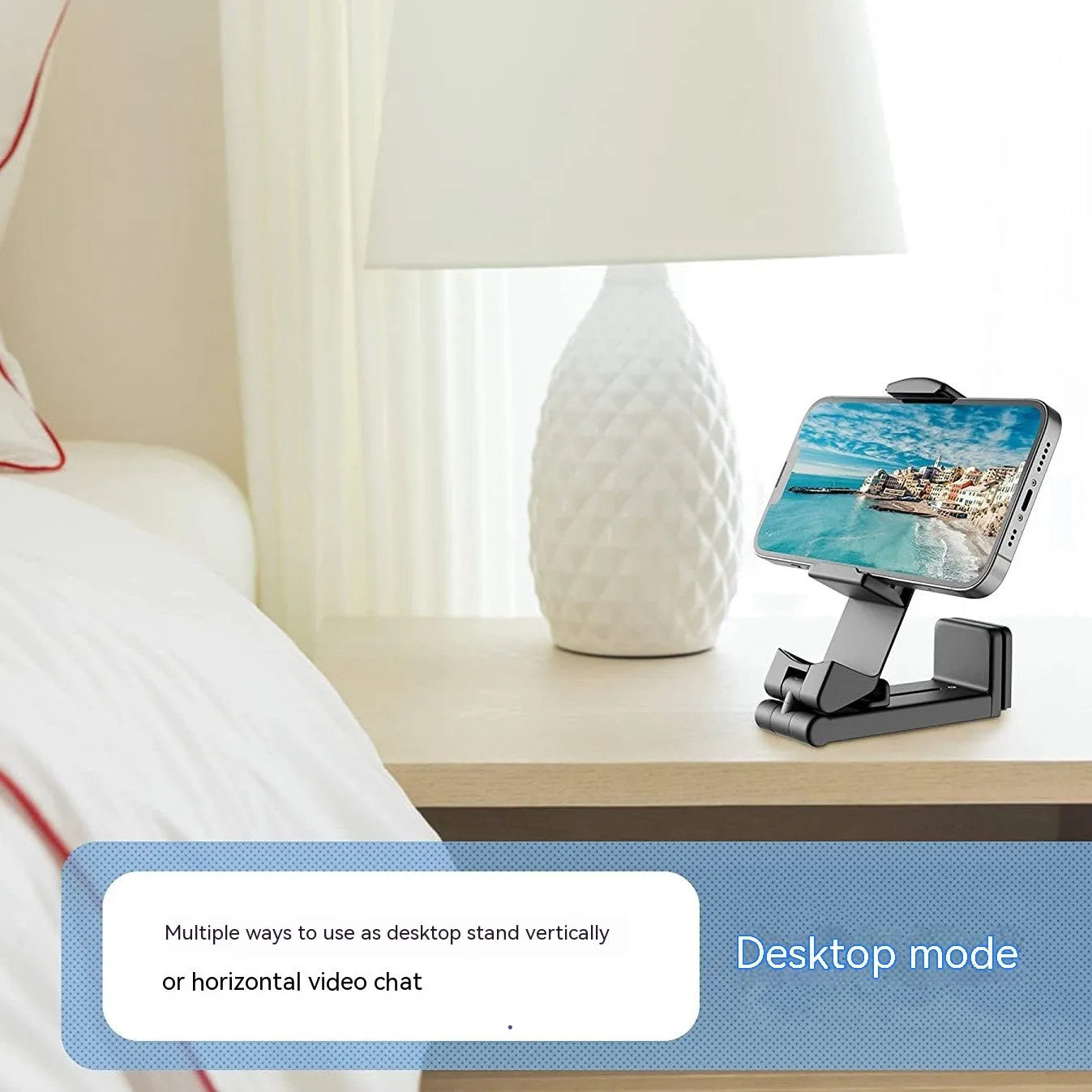 Foldable rotating phone holder in black showing adjustable angle mechanism with phone in landscape position
