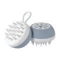 Yellow silicone pet bath brush and massage comb with 3D massage head on a blue background.