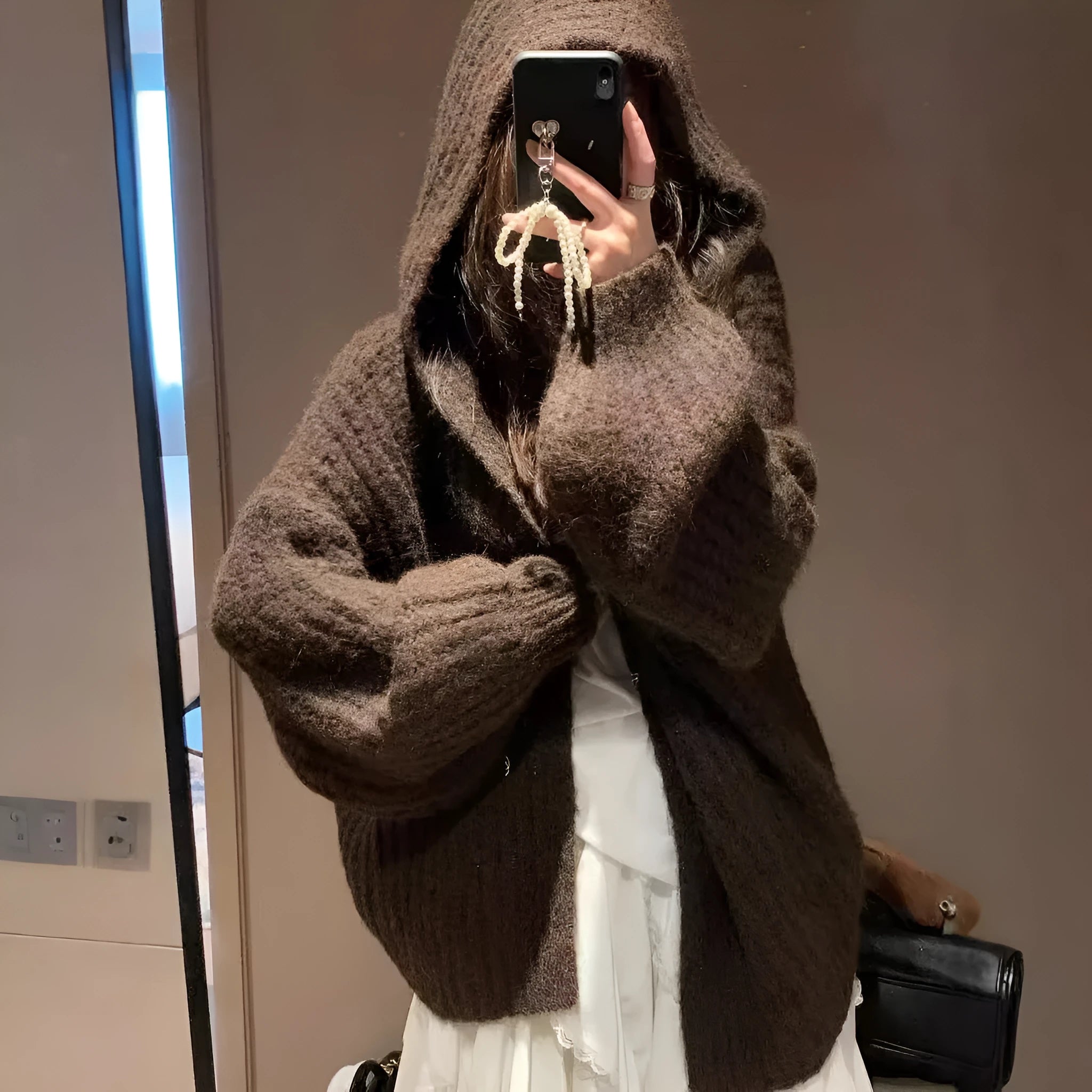 Women's dark grey retro-style hooded sweater cardigan on a hanger.