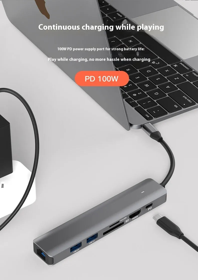Silver aluminium 7-in-1 USB-C hub with SD card slot, microSD slot, USB-A, and USB-C ports.